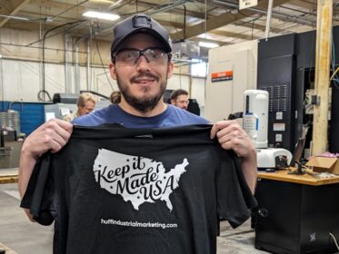 guy holding keep it made usa shirt