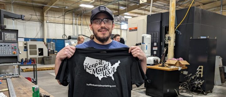 guy holding keep it made usa shirt